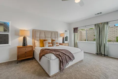 a bed room with a bed and a window