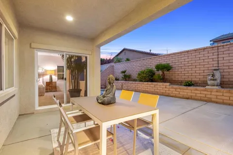 a view of an outdoor dining space with furniture