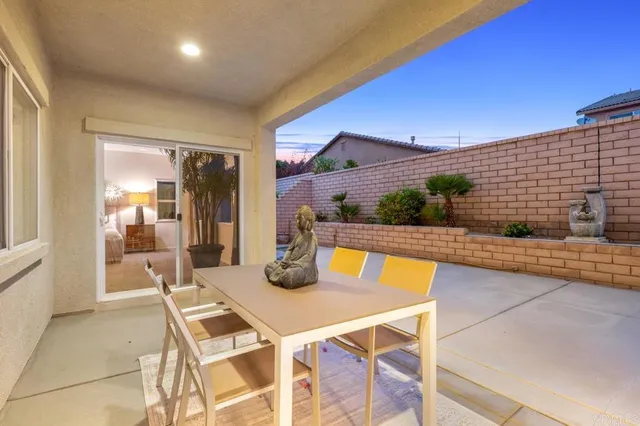 a view of an outdoor dining space with furniture