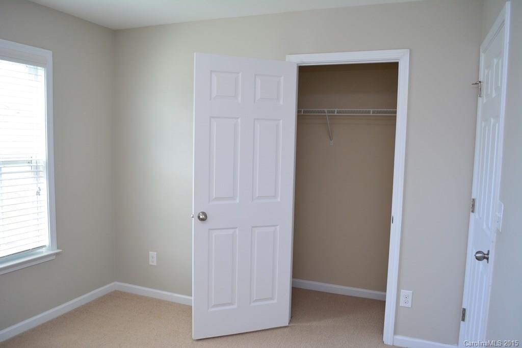 657 Shellbark Drive Concord, NC 28025 - Photo 21 of 24 an empty room with windows and closet