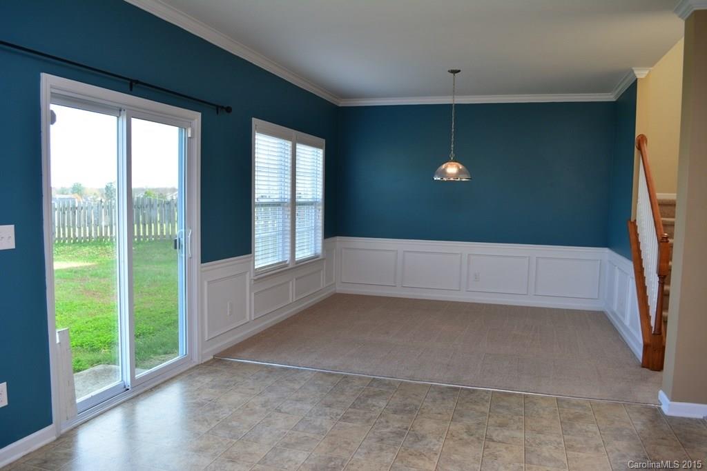 657 Shellbark Drive Concord, NC 28025 - Photo 23 of 24 a view of an empty room with wooden floor and a window