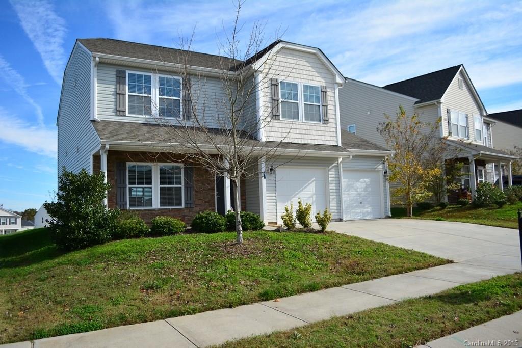 657 Shellbark Drive Concord, NC 28025 - Photo 4 of 24 a front view of a house with a yard and porch