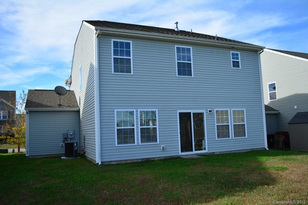 657 Shellbark Drive Concord, NC 28025 - Photo 6 of 24 a front view of a house with a garden