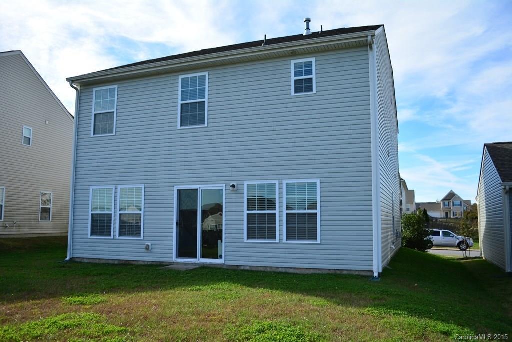 657 Shellbark Drive Concord, NC 28025 - Photo 7 of 24 a front view of a house with a garden