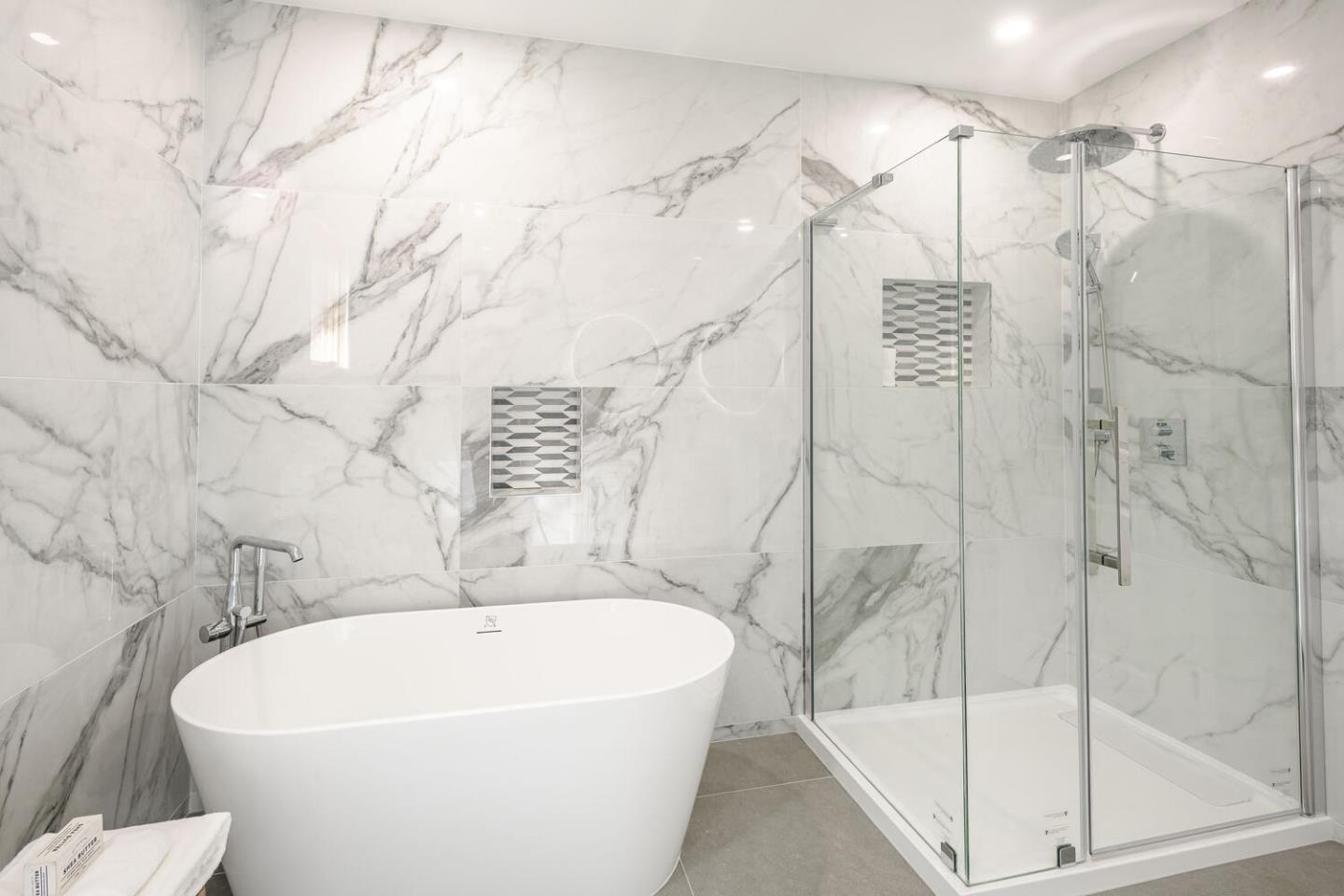 611 Bayview Avenue Millbrae, CA 94030 - Photo 13 of 34 a white bath tub sitting next to a white sink and vanity