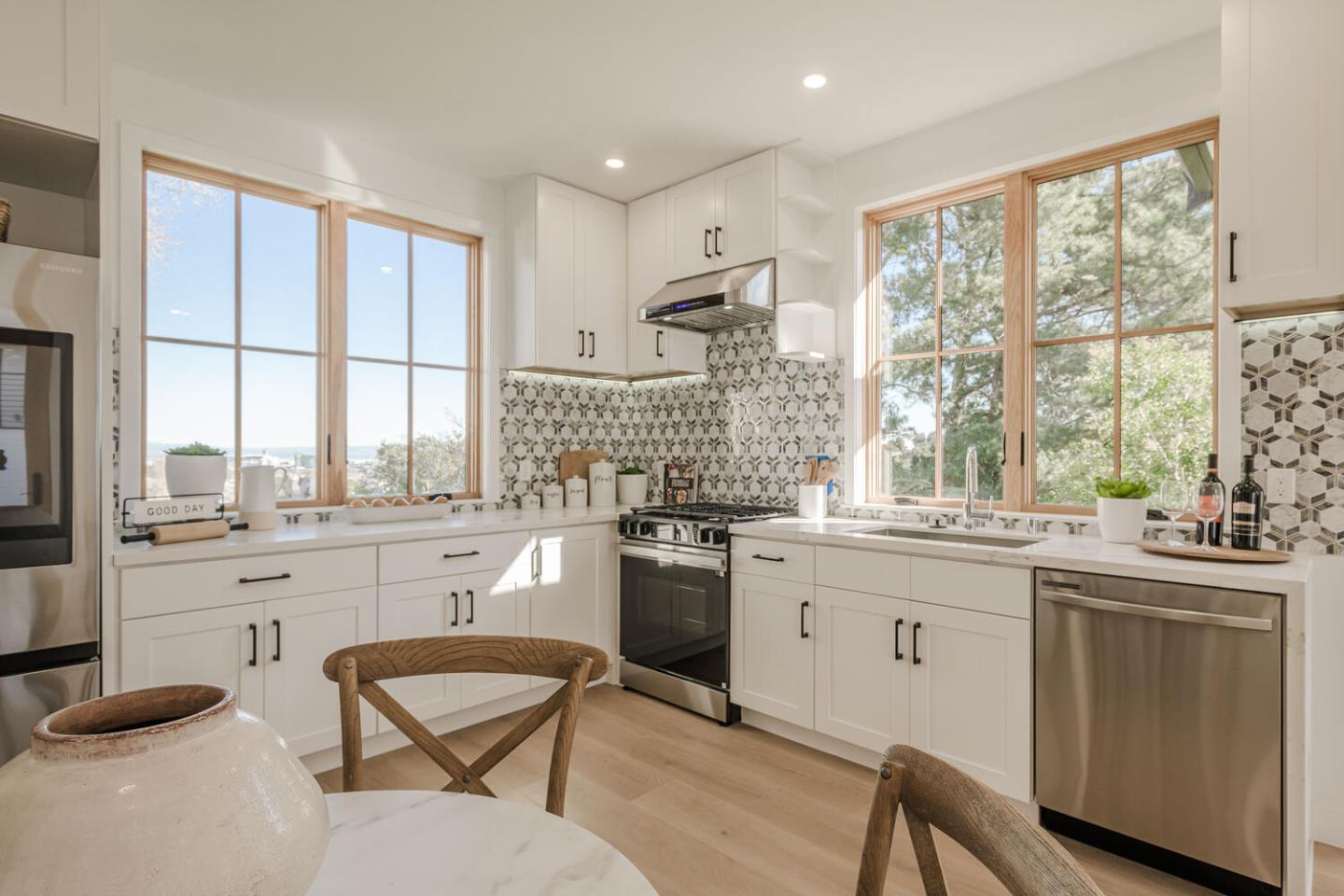 611 Bayview Avenue Millbrae, CA 94030 - Photo 25 of 34 a kitchen with a sink stove and cabinets