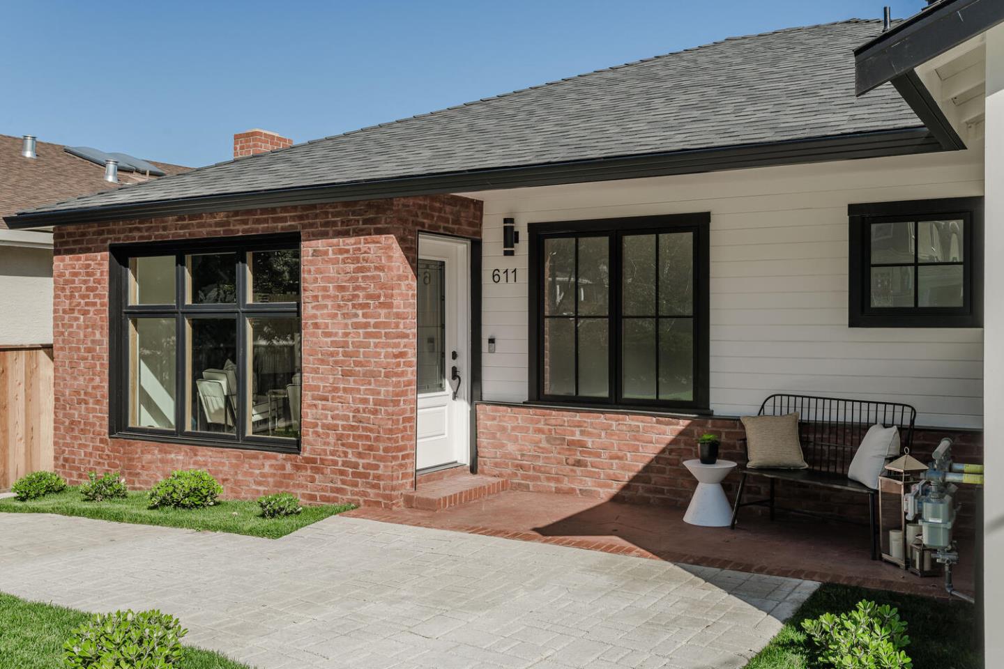 611 Bayview Avenue Millbrae, CA 94030 - Photo 3 of 34 a front view of a house with garden and plants