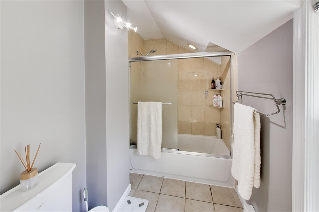 22 Douglas Road Ashland, MA 01721 - Photo 18 of 24 a bathroom with a bathtub and a shower