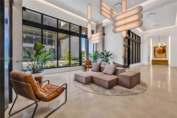 a living room with furniture and a large window