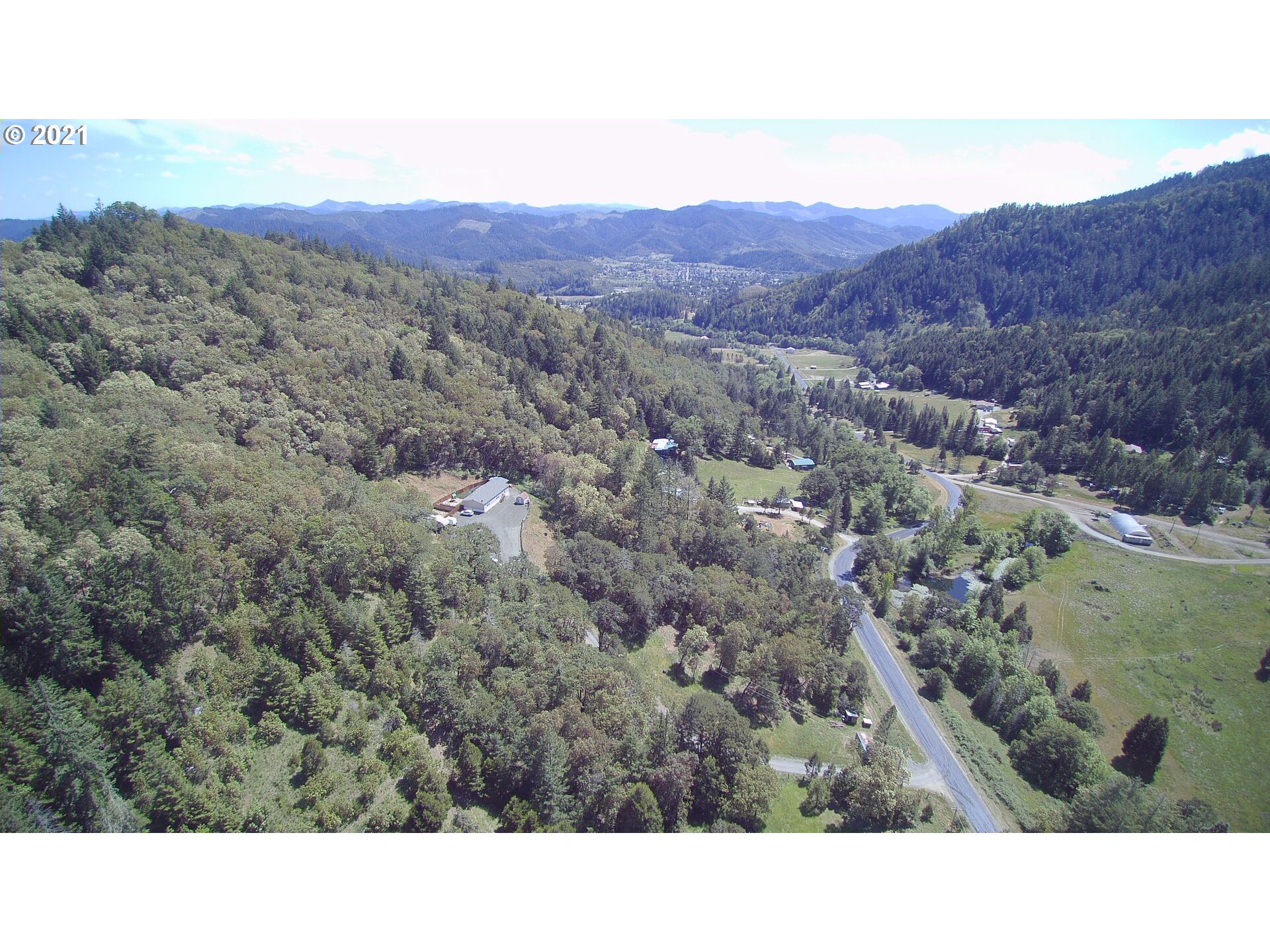 1827 Spring Brook Road Myrtle Creek, OR 97457 - Photo 9 of 15 a view of a mountain in the distance