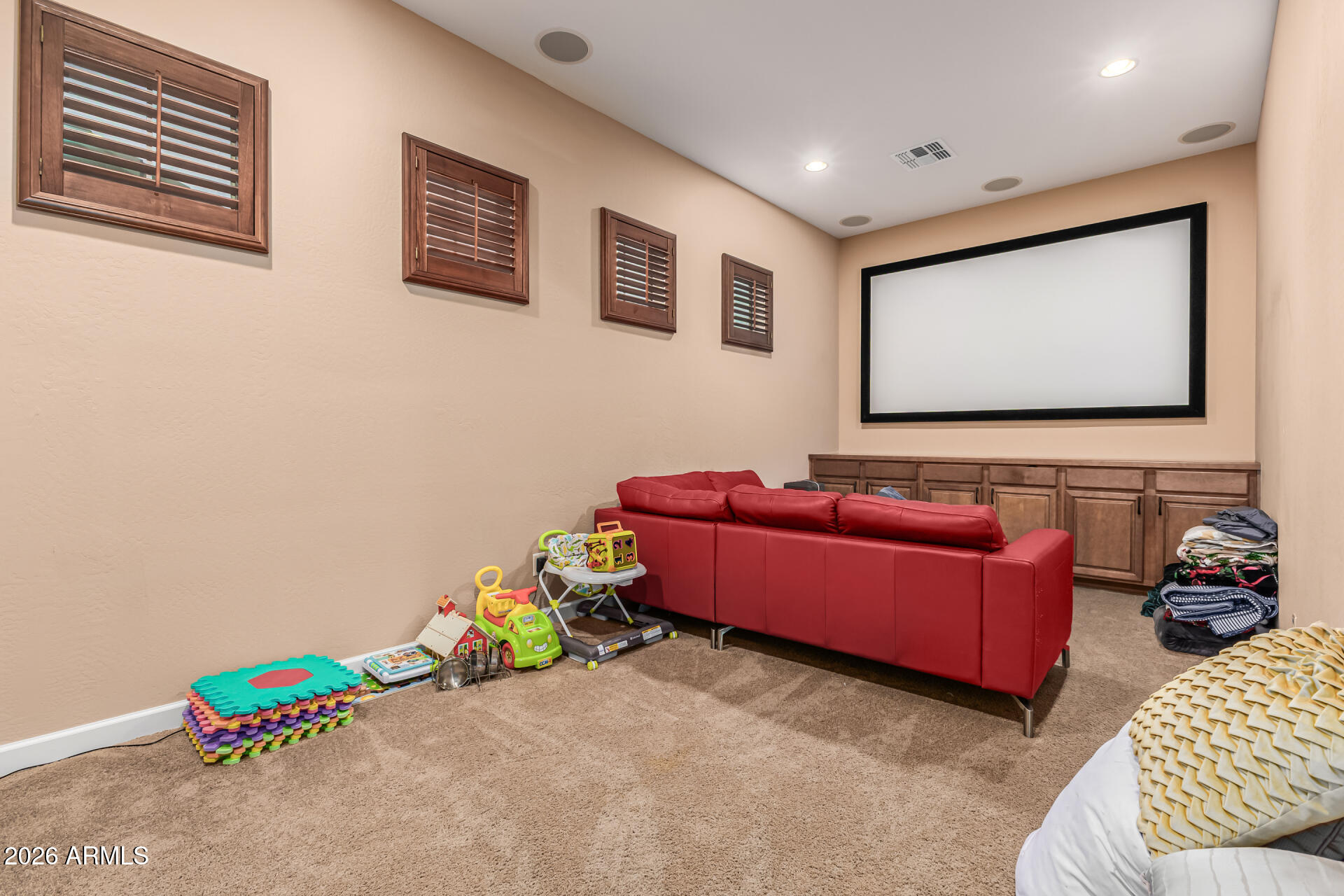 3139 East Harwell Road Phoenix, AZ 85042 - Photo 28 of 45 a living room with furniture and a flat screen tv