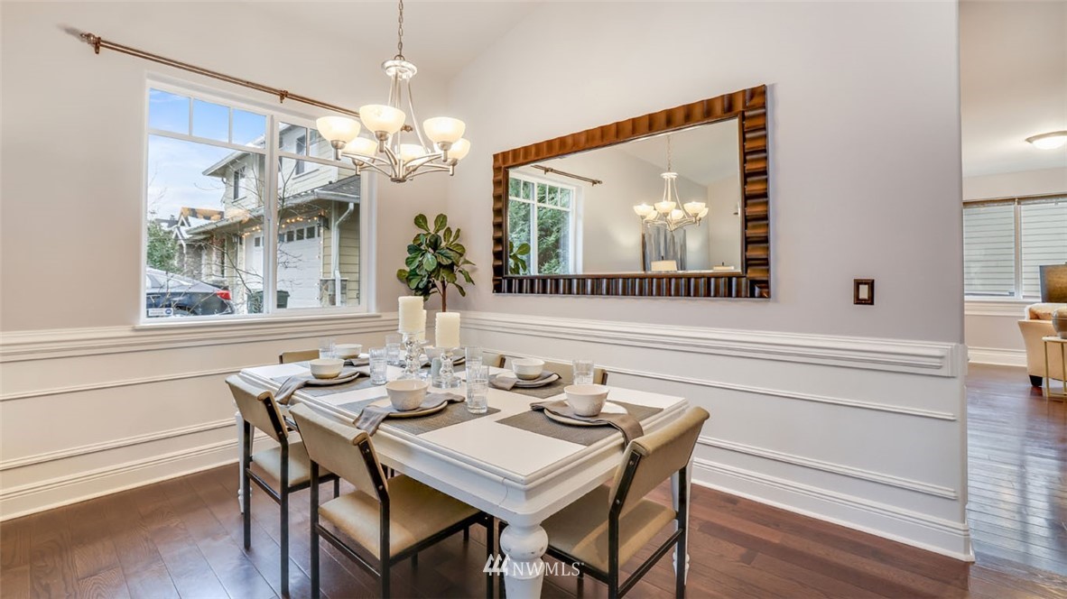 16013 Southeast 137th Terrace Renton, WA 98059 - Photo 6 of 40 a view of a dining room with furniture wooden floor and chandelier