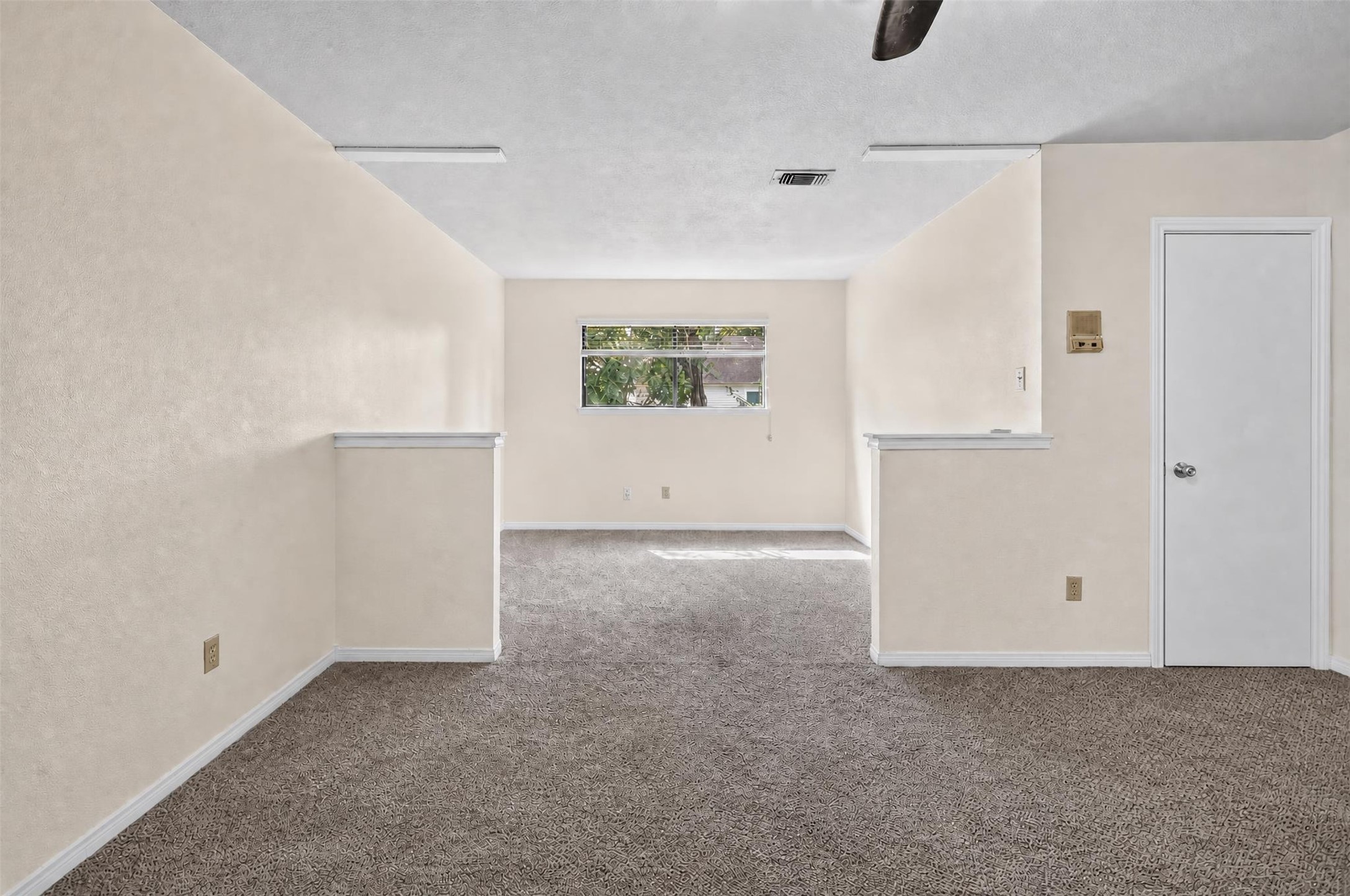 7019 Wyoma Trail Spring, TX 77379 - Photo 19 of 34 Oversized primary bedroom room with plush carpeting and a ceiling fan, offering a cozy atmosphere and natural light.