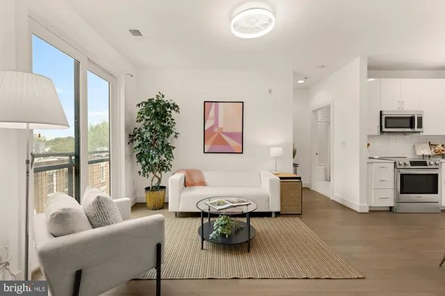 a living room with furniture and a table