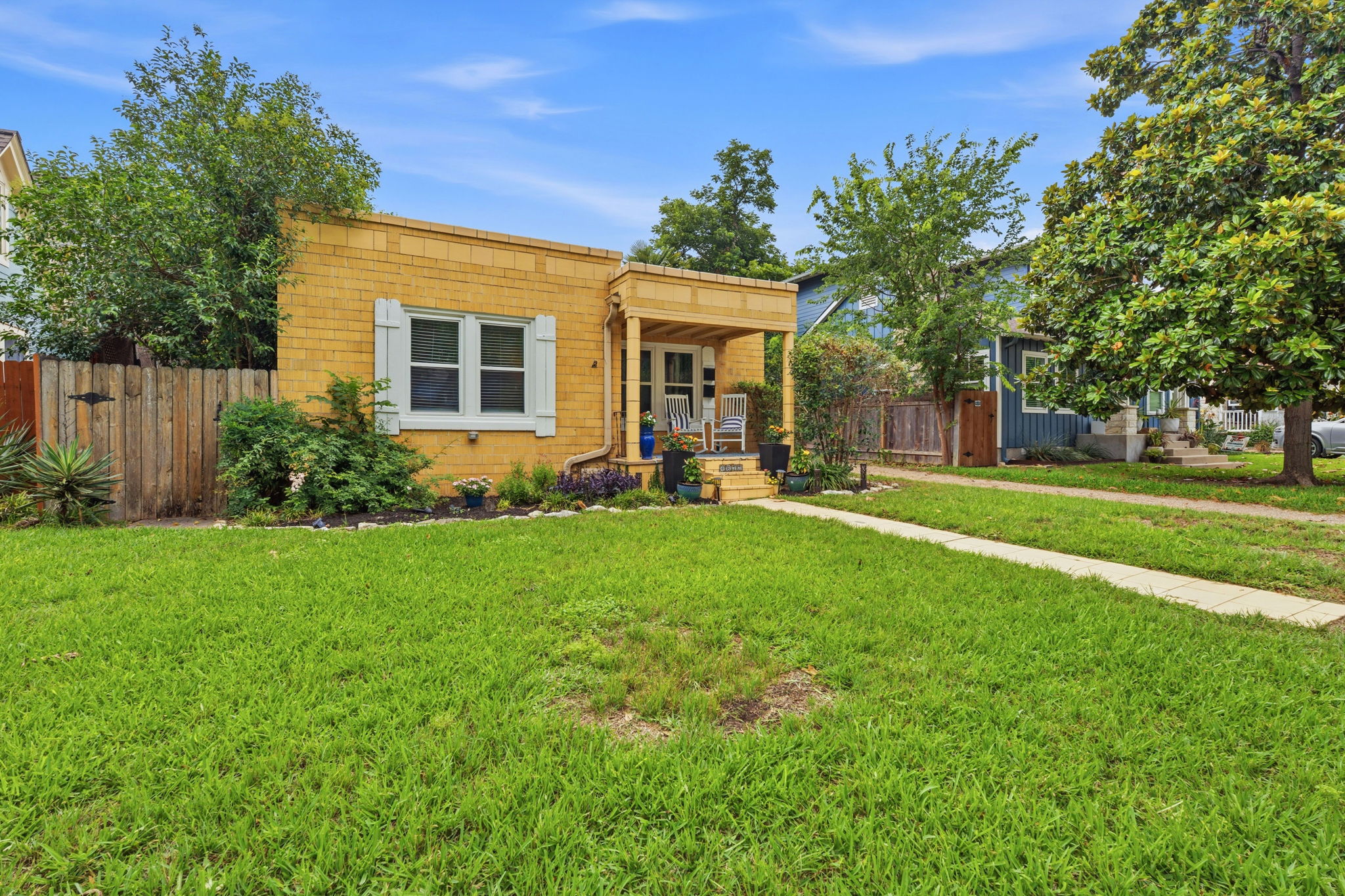4611 Rosedale Avenue Austin, TX 78756 - Photo 2 of 35 The duplex's distinctive Santa Fe architecture delivers instant curb appeal in a neighborhood celebrated for its charm — a property that draws attention before you ever step inside.
