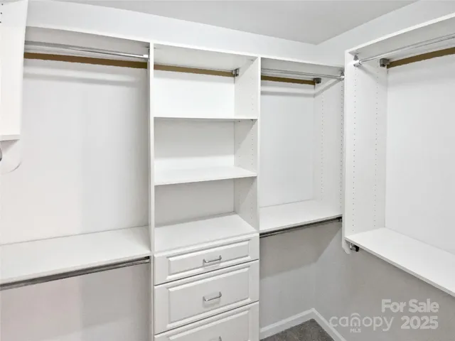 a view of an empty walk in closet