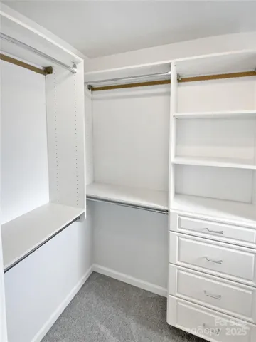 a view of an empty walk in closet