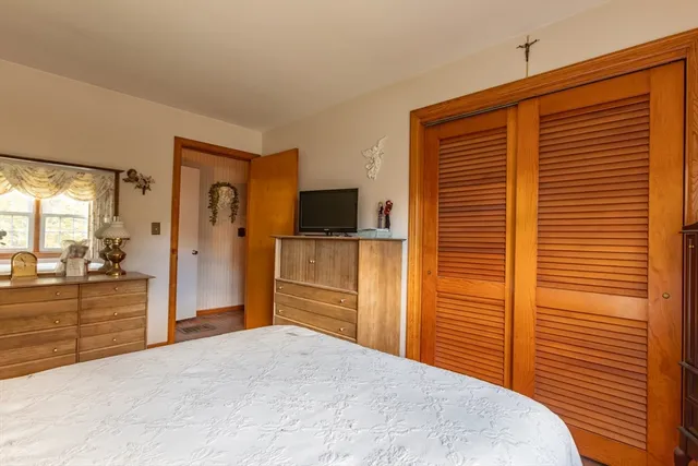 a view of a bathroom with a tub sink and mirror