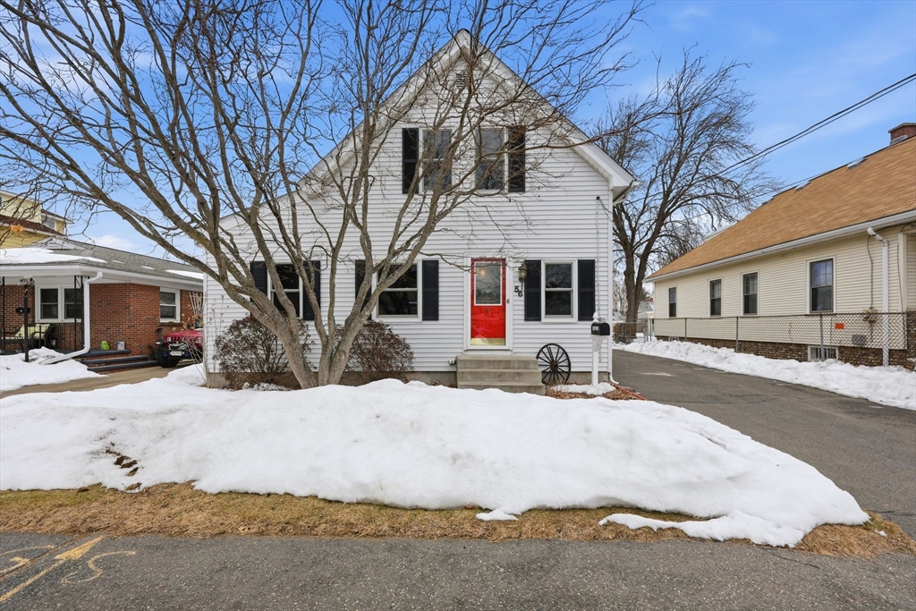56 Percy Street Chicopee, MA 01020 - Photo 1 of 42 a view of a white house with a yard covered in snow
