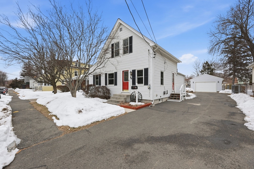 56 Percy Street Chicopee, MA 01020 - Photo 2 of 42 a view of a white house with a snow on the road