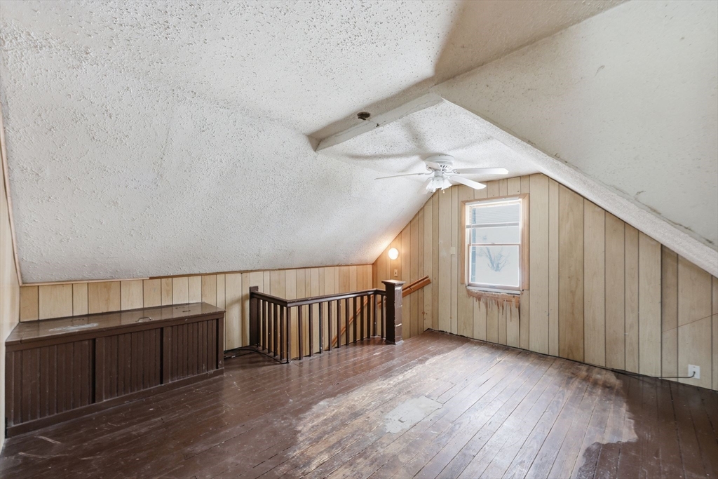 56 Percy Street Chicopee, MA 01020 - Photo 29 of 42 a view of staircase with wooden floor and white walls