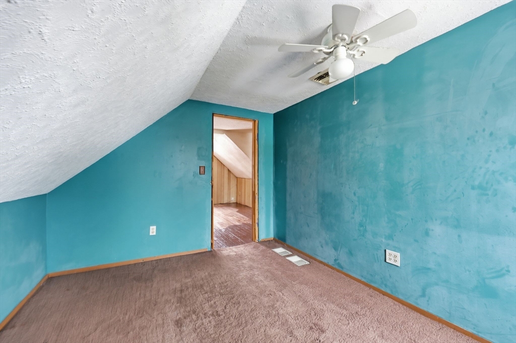 56 Percy Street Chicopee, MA 01020 - Photo 33 of 42 a view of a hallway with a yellow space