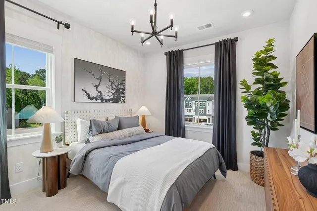 a large kitchen with a table and chairs