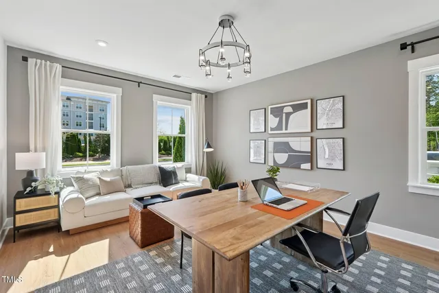 a view of an entryway with wooden floor and windows