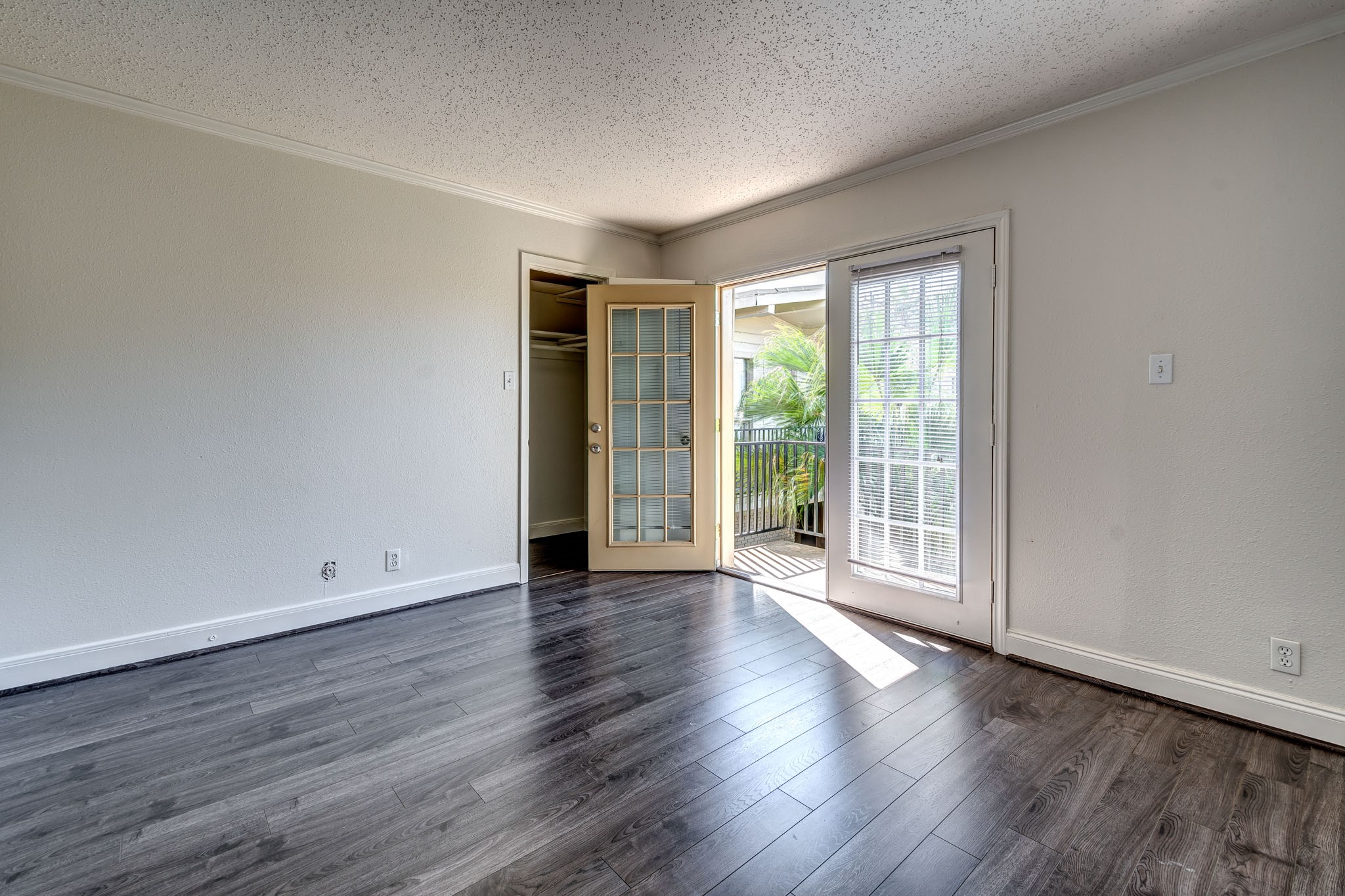 4321 Hazard Street, Unit 9 Houston, TX 77098 - Photo 3 of 11 a view of an empty room with wooden floor and a window
