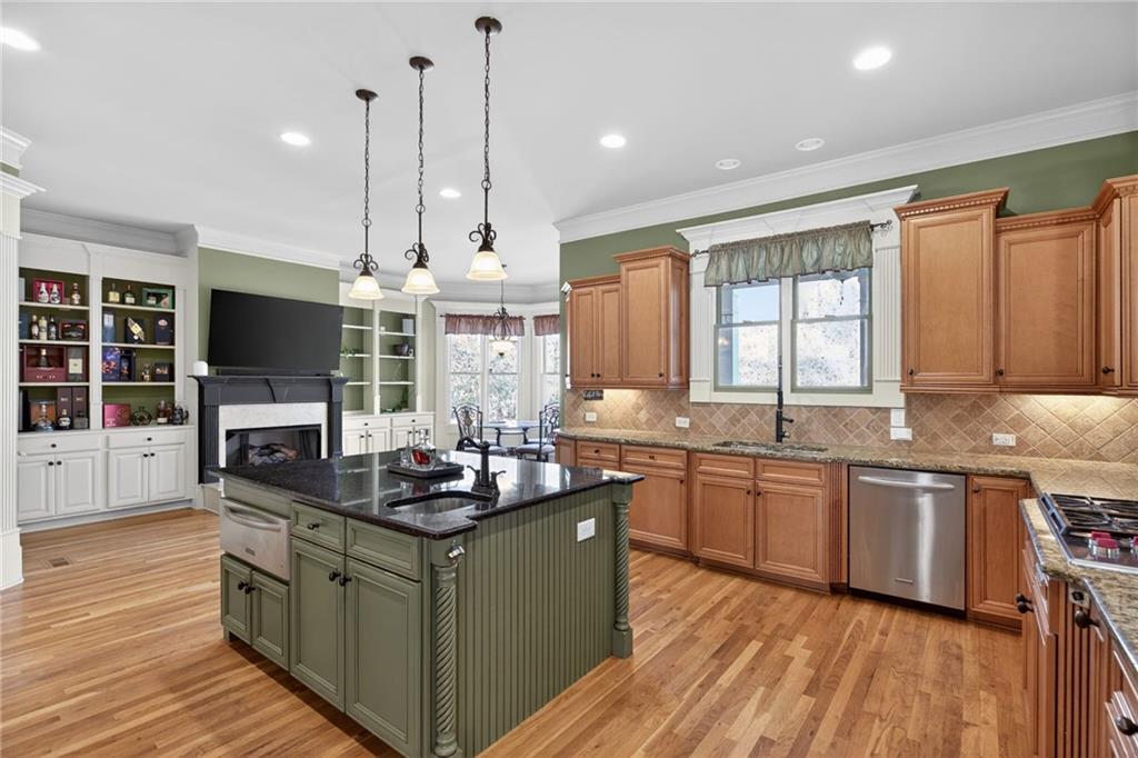 121 Carson Place Carrollton, GA 30117 - Photo 14 of 43 a kitchen with stainless steel appliances granite countertop a stove and a sink