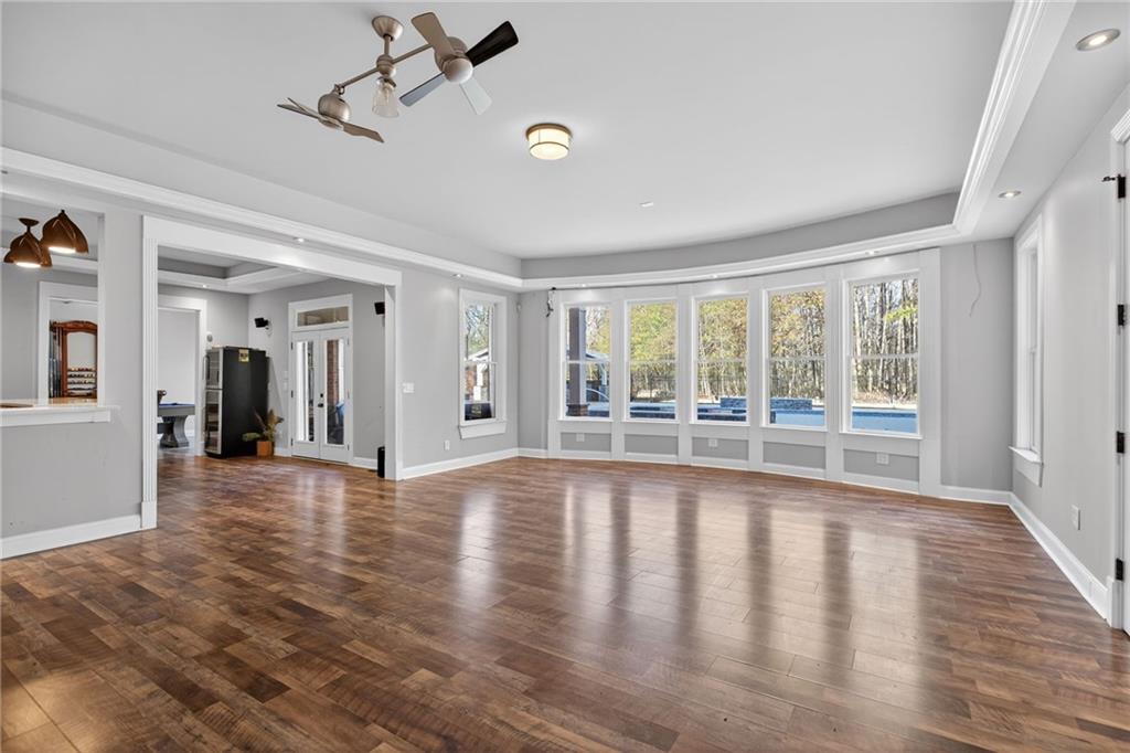 121 Carson Place Carrollton, GA 30117 - Photo 28 of 43 a view of an empty room with wooden floor and a window