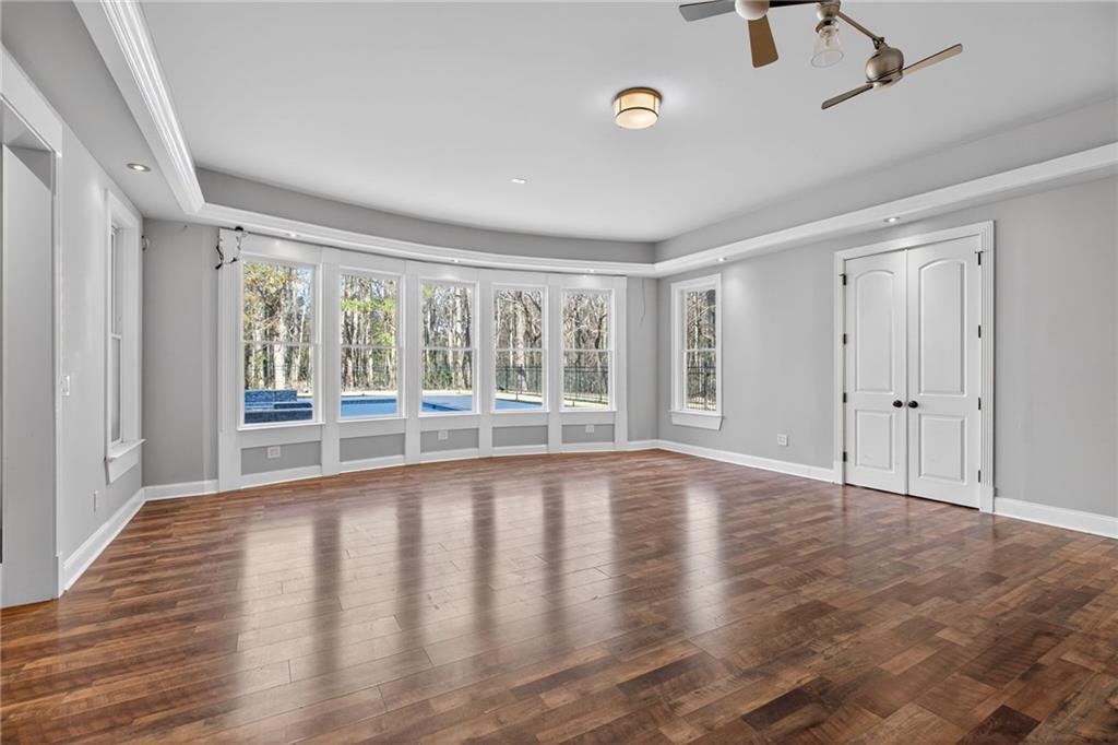 121 Carson Place Carrollton, GA 30117 - Photo 29 of 43 a view of an empty room with wooden floor and a window