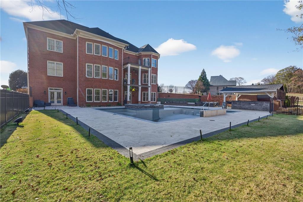 121 Carson Place Carrollton, GA 30117 - Photo 40 of 43 a swimming pool with outdoor seating and yard