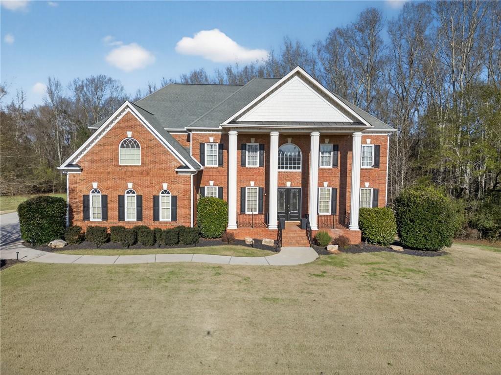 121 Carson Place Carrollton, GA 30117 - Photo 4 of 43 a front view of a house with a yard