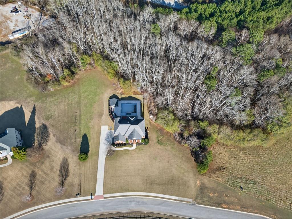 121 Carson Place Carrollton, GA 30117 - Photo 42 of 43 a bench is sitting in the middle of a yard