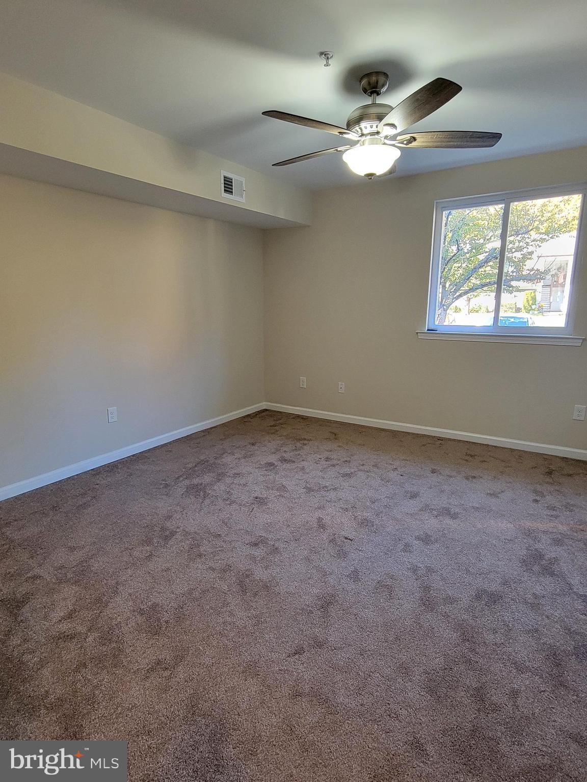 411 North Stiles Avenue, Unit E3 Maple Shade, NJ 08052 - Photo 11 of 14 an empty room with windows and fan