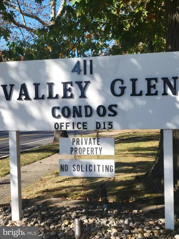a kitchen with a stove and cabinets