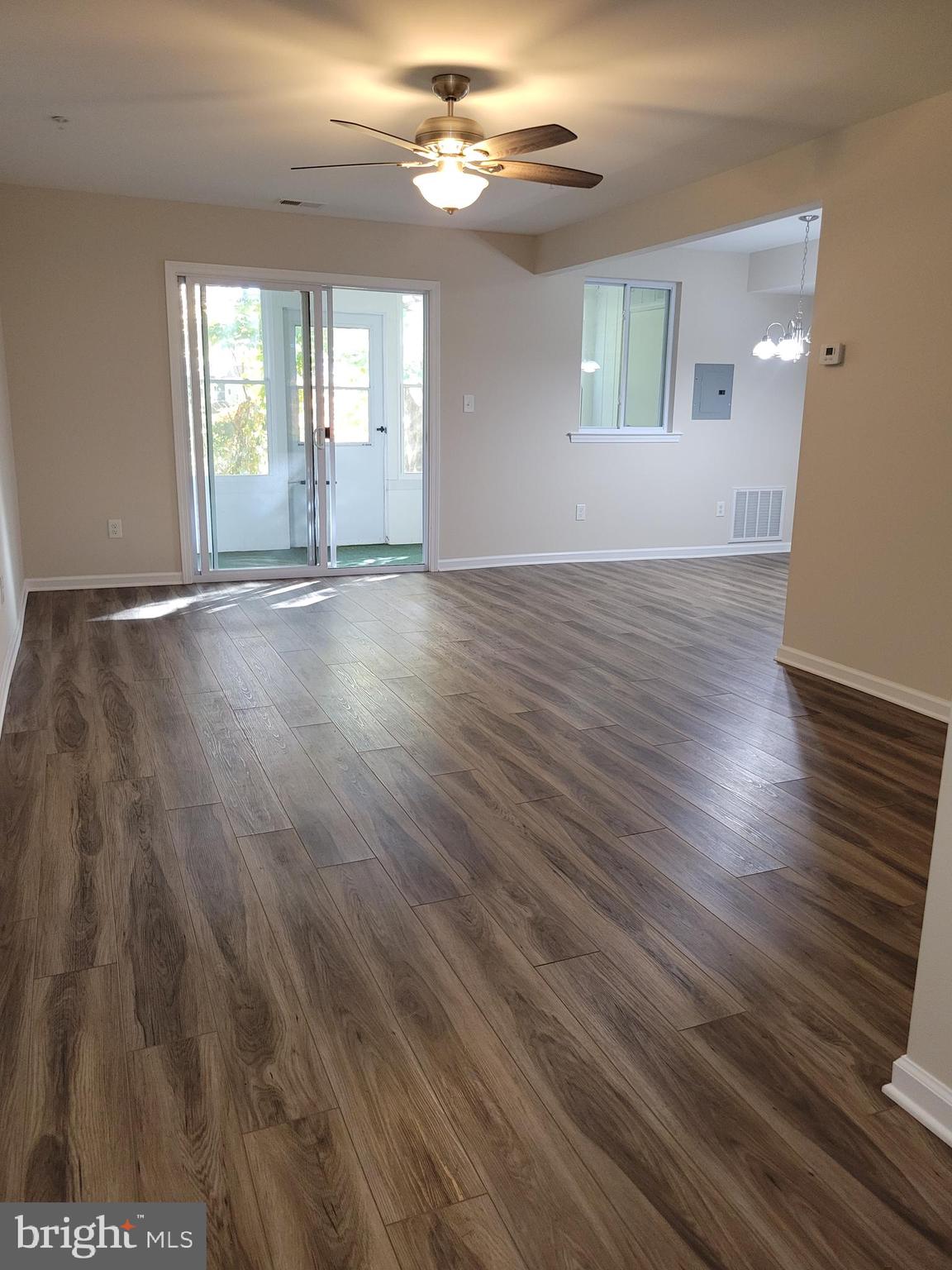 411 North Stiles Avenue, Unit E3 Maple Shade, NJ 08052 - Photo 4 of 14 an empty room with wooden floor and windows