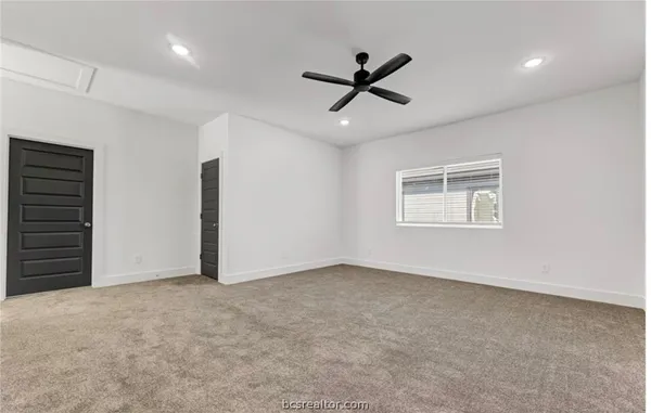 a view of an empty room with a window