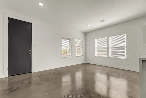 an empty room with windows