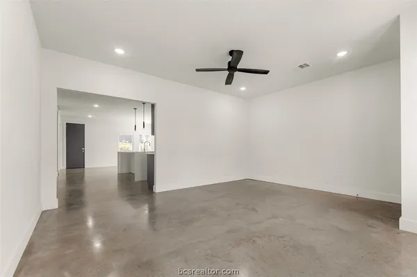 a view of a hallway with a kitchen