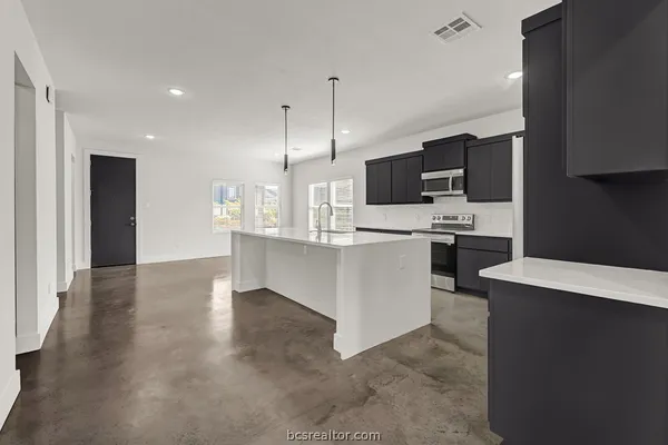 a large kitchen with cabinets