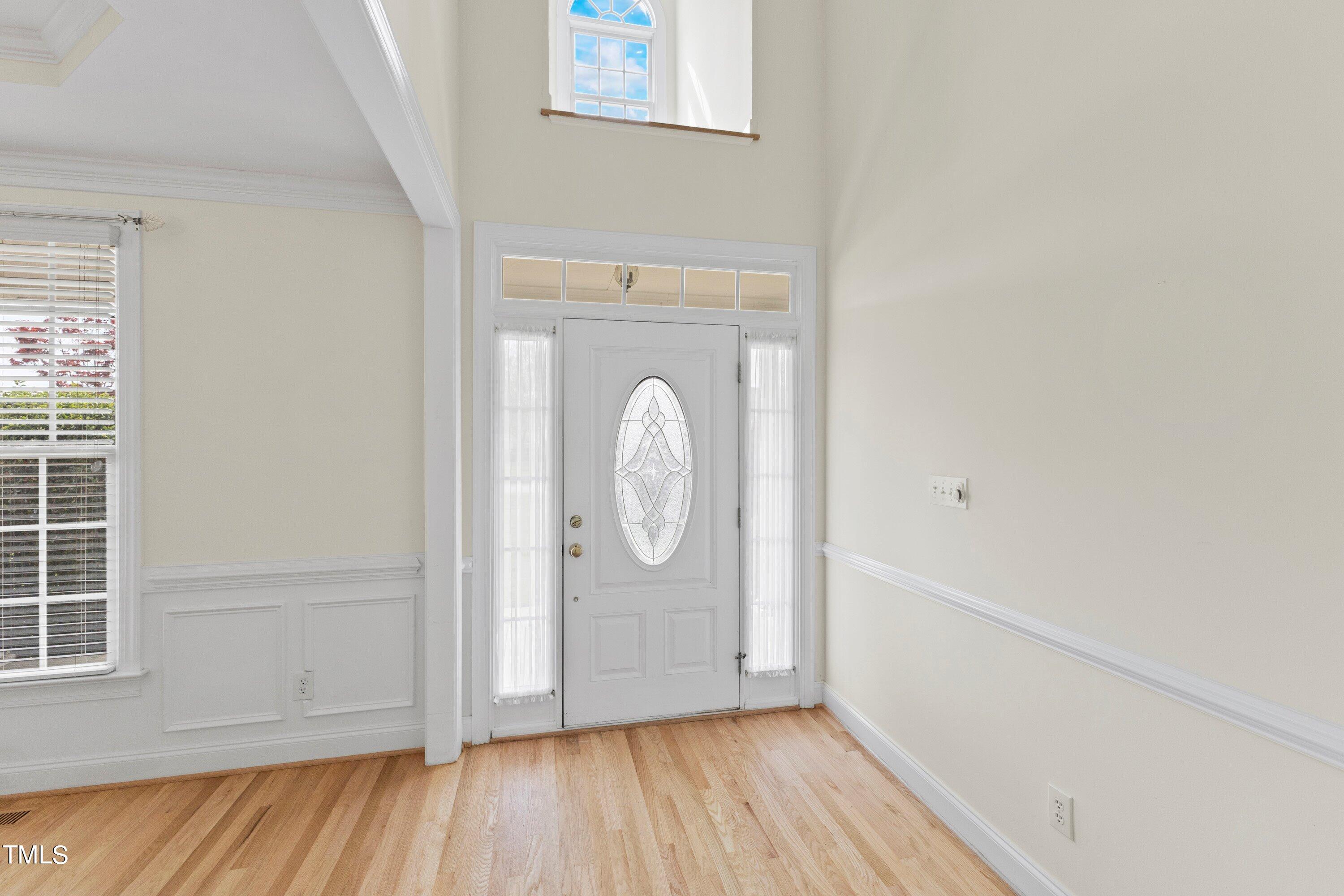 1004 Pasture View Lane Raleigh, NC 27603 - Photo 6 of 48 The 2-story foyer opens up to the formal dining room.