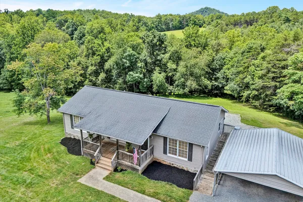 an aerial view of a house having yard