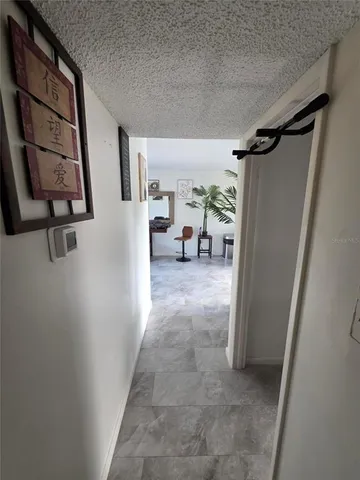 a view of livingroom with furniture and window