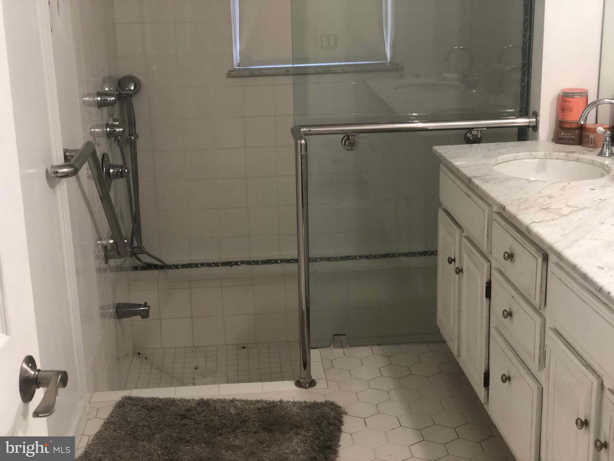 351 Hidden River Road Penn Valley, PA 19072 - Photo 7 of 48 a bathroom with a granite countertop shower