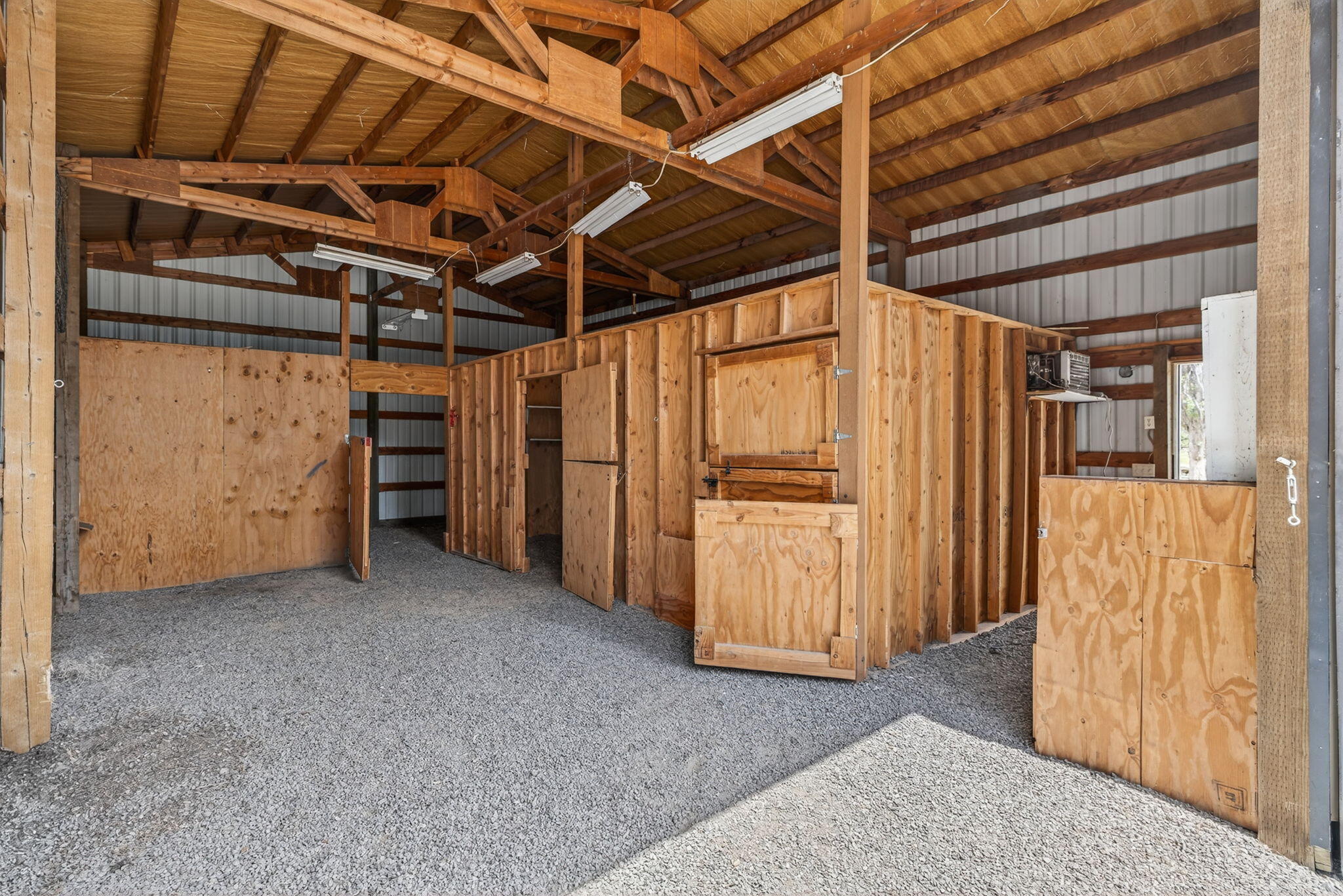 22818 McGrath Road Bend, OR 97701 - Photo 42 of 57 Barn interior with walk in cooler and 2 stalls