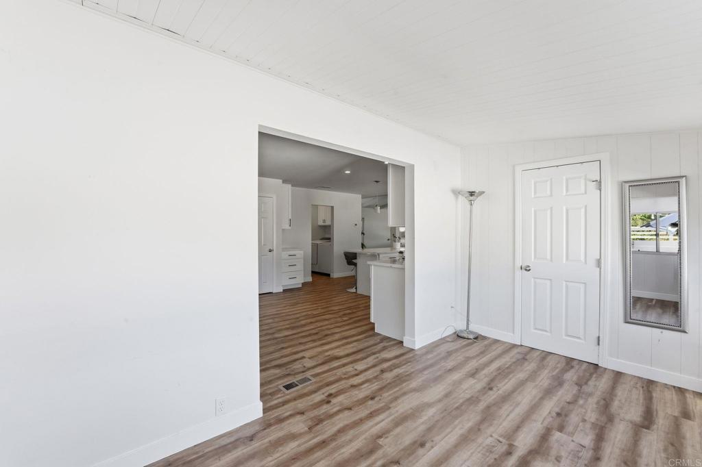 1195 La Moree Road, Unit 98 San Marcos, CA 92078 - Photo 15 of 28 a view of a room with wooden floor and a bathroom