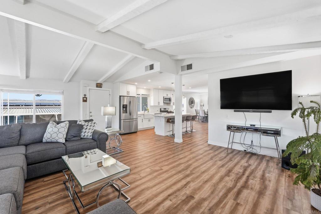 1195 La Moree Road, Unit 98 San Marcos, CA 92078 - Photo 2 of 28 a living room with furniture and a flat screen tv