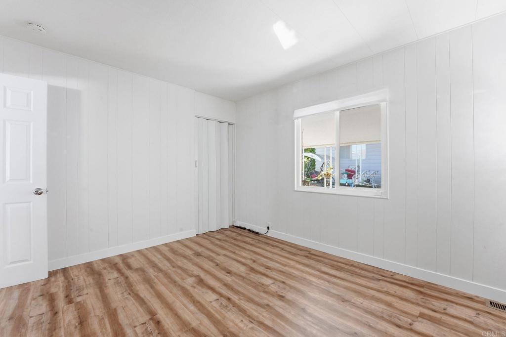 1195 La Moree Road, Unit 98 San Marcos, CA 92078 - Photo 22 of 28 a view of empty room with wooden floor